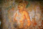Focus on a woman's bare chest and hand raised, Sigiriya Frescoes of ladies, Sri Lanka Ceylon.