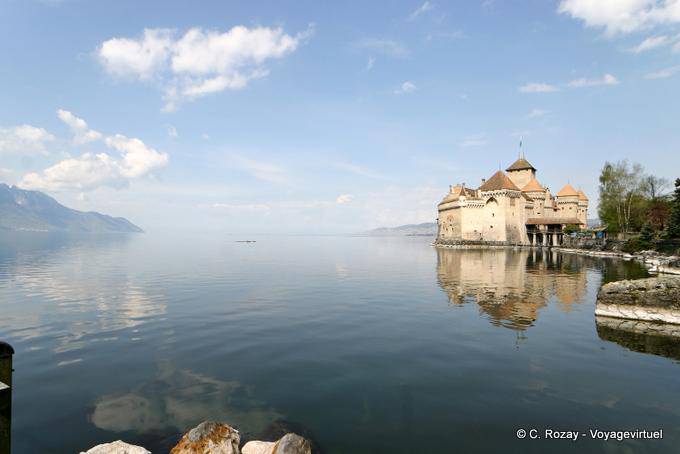 The Chillon Castle reflecting in lake Geneva - Switzerland
