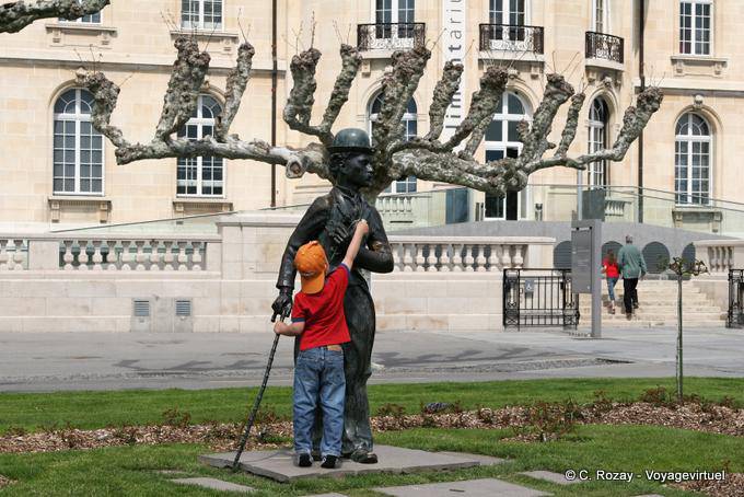 The boy and the statue of Charlie Chaplin, Vevey - Switzerland