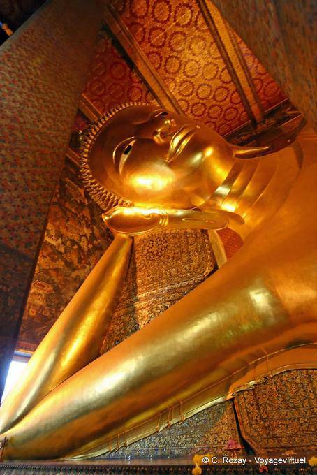 Head leaning of the Reclining Buddha, Wat Pho, Bangkok - Thailand