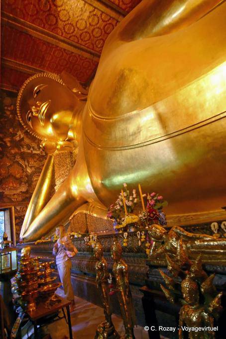 Buddha lying on his deathbed, accessing the parinirvana, Wat Pho, Bangkok - Thailand