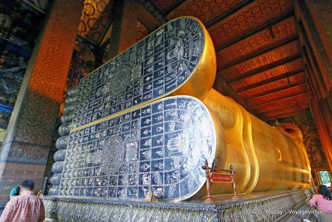 Feet of reclining Buddha with sandals inlaid mother of pearl signs 108 good omens, Wat Pho, Bangkok - Thailand