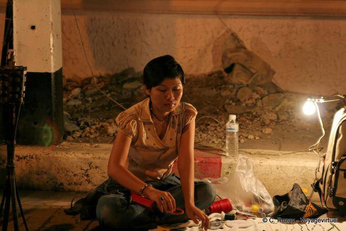 Craftswoman at the night market, Chiang Mai - Thailand