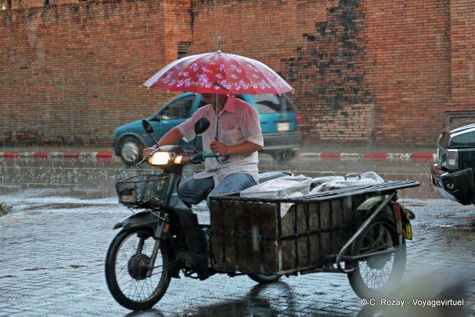 Motorcycle in the rain, Chiang Mai - Thailand