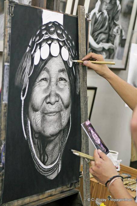 Artist reproducing a typical face, Chiang Mai - Thailand