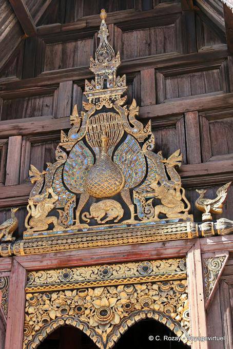 Pediment with a peacock, Wat Phan Tao, Chiang Mai Temple - Thailand