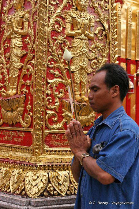 Man praying with lotus Wat Doi Suthep, Chiang Mai - Thailand
