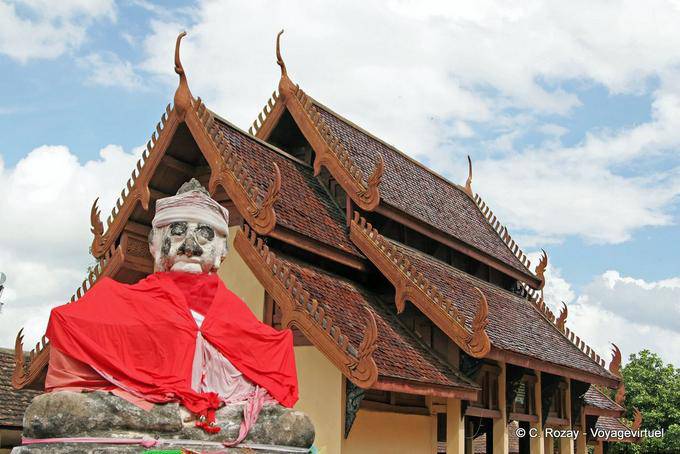 Bizarre Buddha on the back of Viharn Nam Tam, Wat Phra That Lampang Luang - Thailand