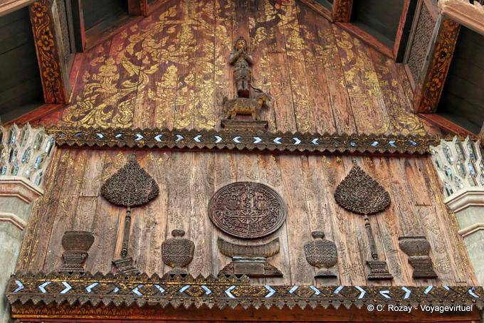 Thewada a figure standing on a goat, wooden sculpture, Wat Phra That Lampang Luang - Thailand