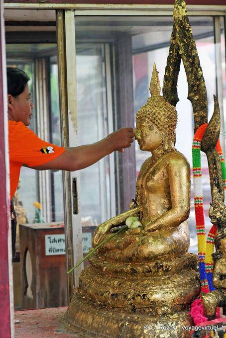 Gold leaf at Wat Sri Rattana affixing Mahathat, Phitsanulok - Thailand