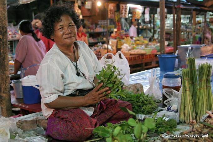 Saleswoman sitting in lotus market Sukhothai - Thailand