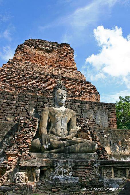 Buddha among the ruins, Sukhothai, Wat Mahathat - Thailand