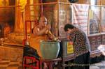 Monk's blessing, Wat Choeng Phanan, Ayutthaya, Thailand.