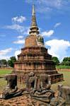 Seated statues in front chedi, Wat Raj Burana, Ayutthaya, Thailand.