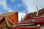 Temple roofs and Chofahs, Wat Wat Choeng Phanan, Ayutthaya, Thailand.