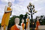 Devotion and floor lamp, Wat Yai Chai Mongkol, Ayutthaya, Thailand.