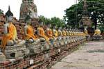 Aligning seated Buddhas, Wat Yai Chai Mongkol, Ayutthaya, Thailand.