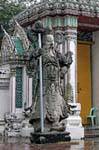 Giant statue standing guard, Wat Pho (Wat Phra Chettuphon), Bangkok, Thailand.