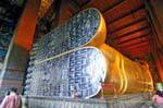 Feet of reclining Buddha with sandals inlaid mother of pearl signs 108 good omens, Wat Pho, Bangkok, Thailand.