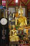 The clock and the Buddhas, Chiang Mai Temple, Thailand.