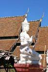 Kneeling statue, Chiang Mai Temple, Thailand.