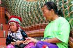 Children in traditional costume, Wat Doi Suthep, Chiang Mai, Thailand.