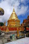 Buddha standing in front of the chedi, Wat Doi Suthep, Chiang Mai, Thailand.