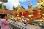 Female praying, Wat Doi Suthep, Chiang Mai, Thailand.