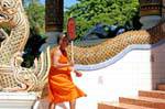 Monk to the panel, Wat Phra Singh, Chiang Mai, Thailand.