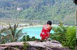Girl admiring Lodalum Bay, Koh Phi Phi, Thailand.
