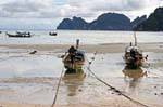 Boats in Tonsai Bay at low tide, Koh Phi Phi, Thailand.