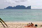 Tourists on the beach, Koh Phi Phi, Thailand.