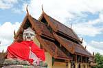 Bizarre Buddha on the back of Viharn Nam Tam, Wat Phra That Lampang Luang, Thailand.