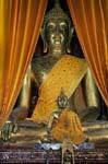 Close-up on bhumisparsha buddha mudra, Wat Phra That Lampang Luang, Thailand.