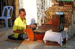 Religious musician, Wat Phra Si Rattana Mahathat, Phitsanulok, Thailand.