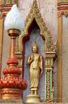 Standing Buddha niche in Wat Chalong, Phuket, Thailand.