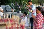 Thais praying at Wat Chalong in Phuket, Thailand.