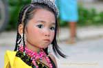 Little girl doubtful, Festival Patong, Phuket, Thailand.