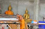 Monk at work, Patong, Phuket Temple, Thailand.