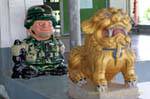 US military and dragon statue, Phuket Town Gypsy, Thailand.