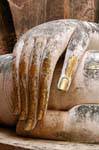 Right hand resting on the knee, Sukhothai, Wat Sri Chum, Thailand.
