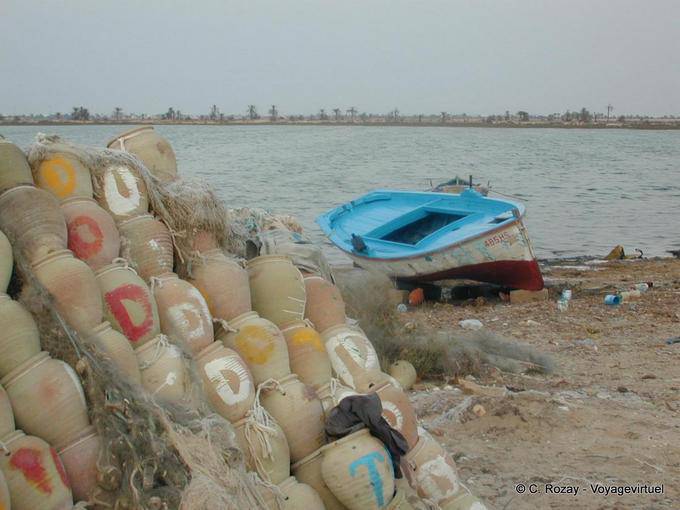 Djerba, boat and water jugs, west coast - Tunisia