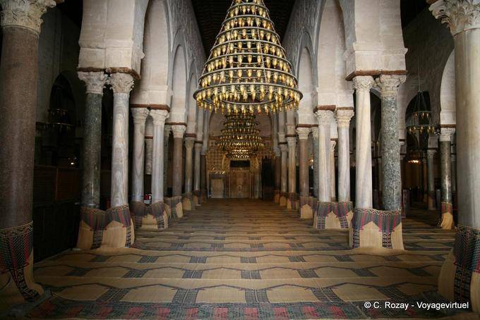 Chandeliers and mihrab basically inside the Sidi Oqba Mosque, Kairouan - Tunisia