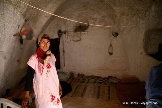Girl in the cave room carved into the mountain, Matmata - Tunisia