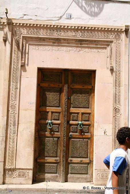 Door with inscriptions on coaching, Sfax - Tunisia