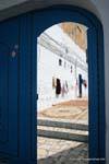 Hammamet, drying laundry and carpet behind the door of the house, Tunisia.