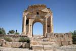 Maktar at the foot of the Arch of Trajan in the Forum entry, Tunisia.