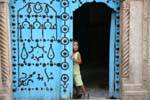 Tunis medina child at the door, Tunisia.