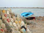 Djerba, boat and water jugs, west coast, Tunisia.