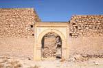 Ancient wall and carved portal of Kerkennah El Abassia, Tunisia.
